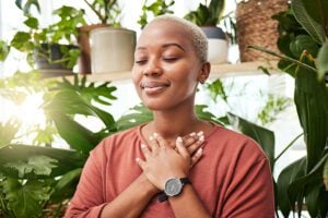 A woman practices breathwork.